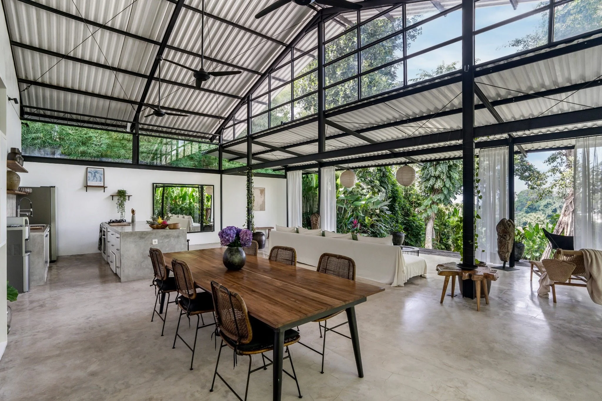 Daylight view across Loft Ithaka's open-plan dining and living space