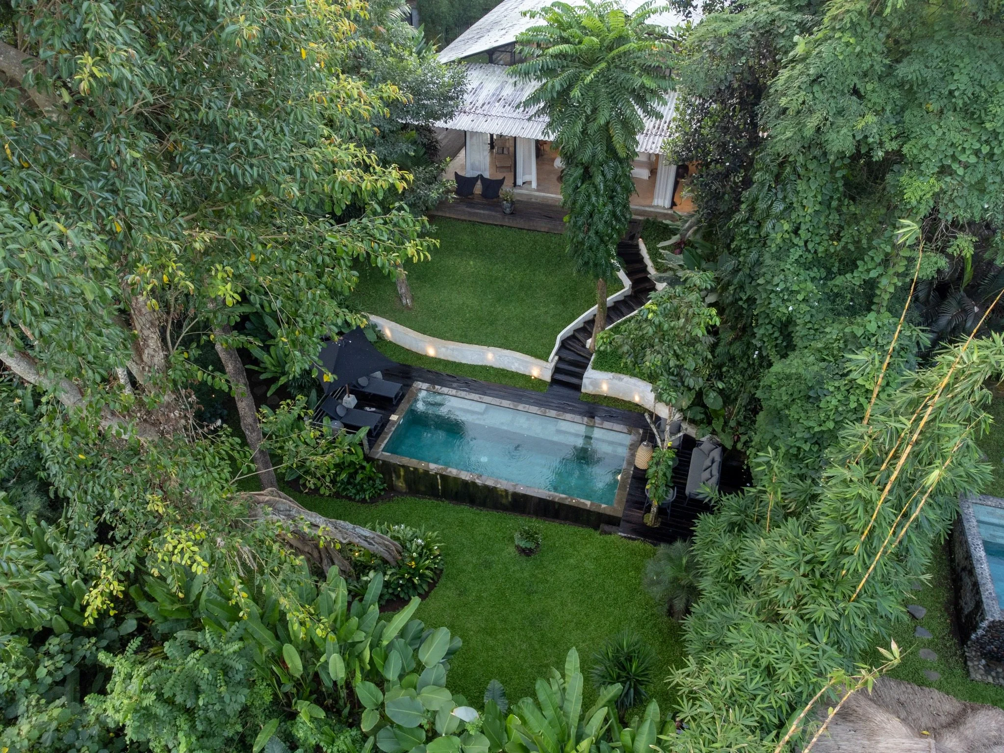 Aerial view of Loft Ithaka surrounded by jungle