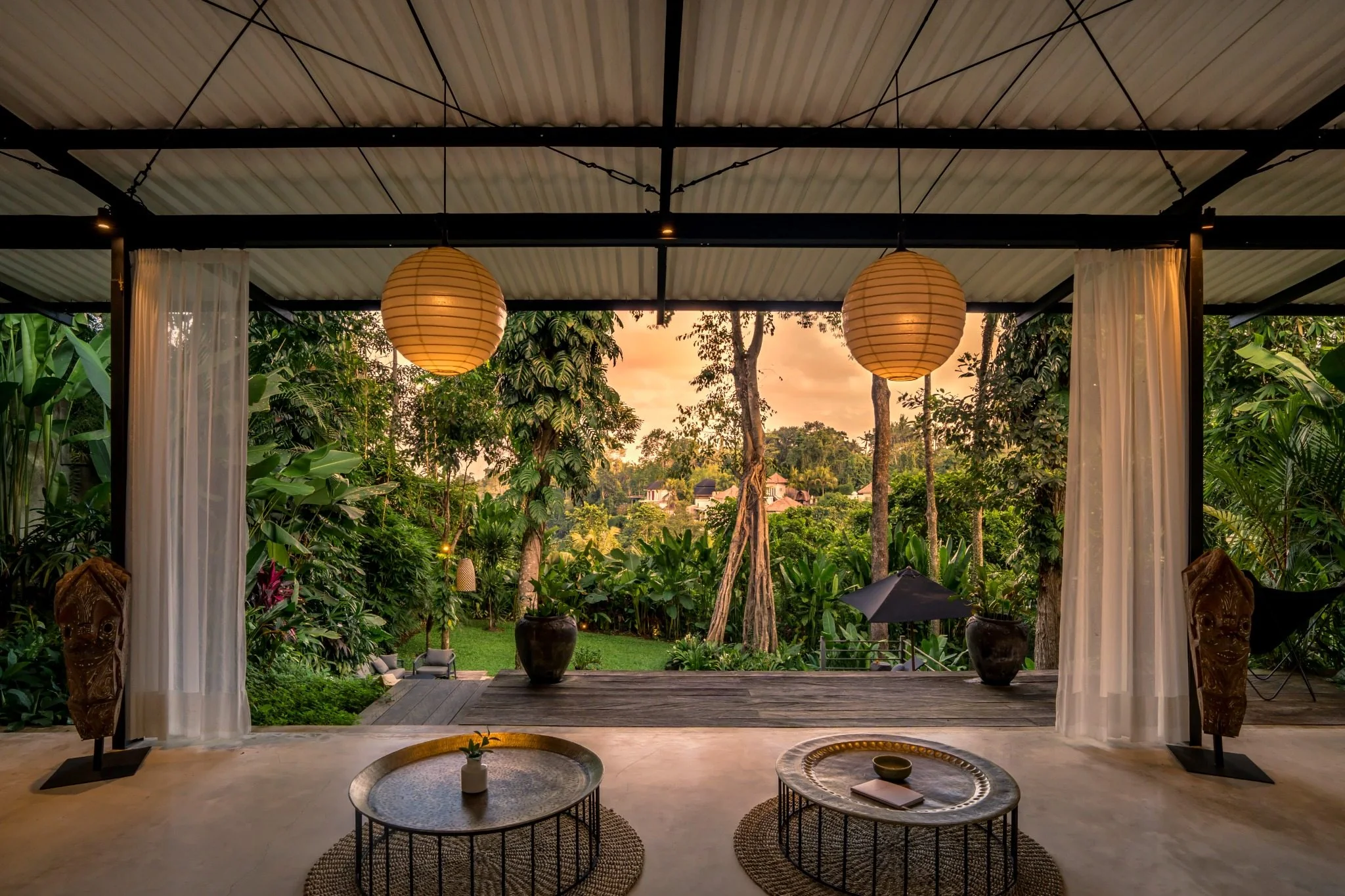 Loft Ithaka living space opening directly to the tropical landscape
